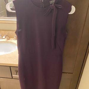 The limited size 2 purple dress w faux bow detail at neck